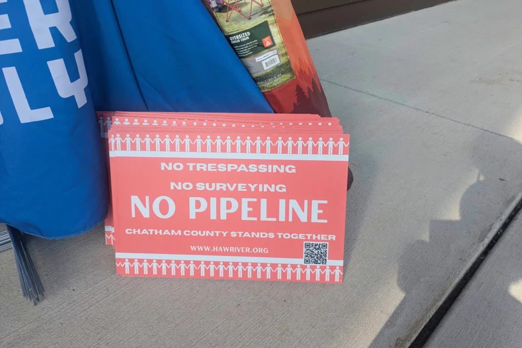 A close-up photo of a stack of red signs that read, 